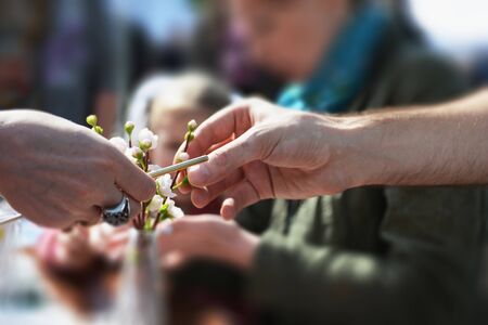 Craft - the hands of the people in the blurred background. Art lesson outdoor.の写真素材