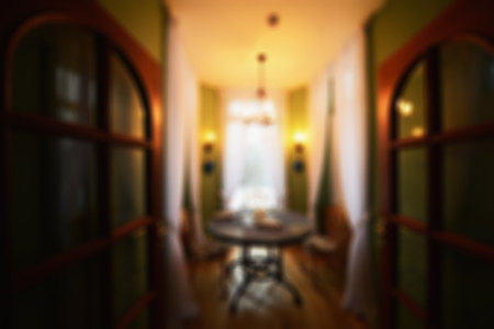 Premise interior on blurred background. Abstract stylish and harmonious design of the restaurant attracts visitors.の写真素材