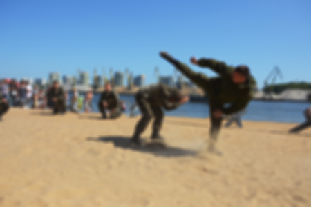 The river beach - blurred background. The combat exercises of the platoon special forcesの写真素材