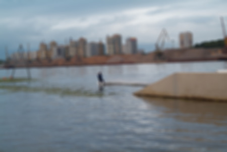 Blurred background- people active days on the river. Wake boarding - water sport to strengthen the body.の写真素材