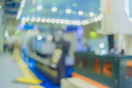 Blurred background. Business people in interiors, exhibitions a variety of lighting. Filmed with a special lens to produce bokeh.の写真素材