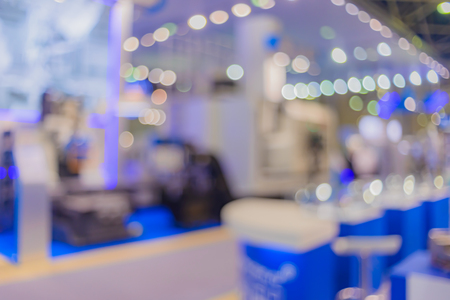 Blurred background. Business people in interiors, exhibitions a variety of lighting. Filmed with a special lens to produce bokeh.の写真素材
