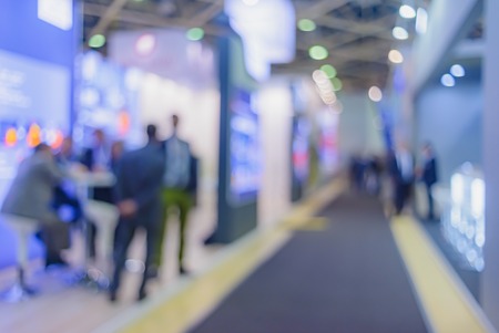 Blurred background. Business people in interiors, exhibitions a variety of lighting. Filmed with a special lens to produce bokeh.の写真素材