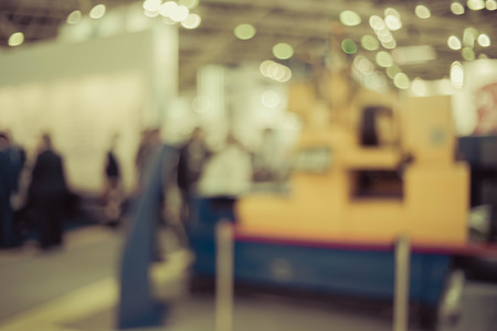Blurred background the industrial exhibition - wonderful bokeh of light sources.の写真素材