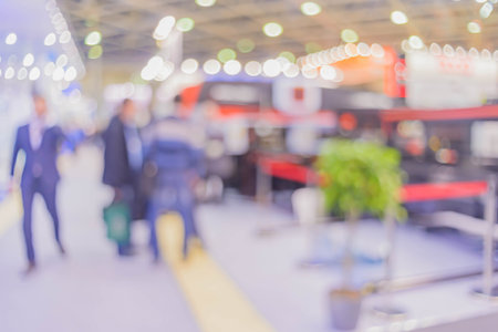 Blurred background the industrial exhibition - wonderful bokeh of light sources.の写真素材