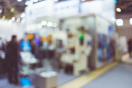 Blurred background the industrial exhibition - wonderful bokeh of light sources.の写真素材