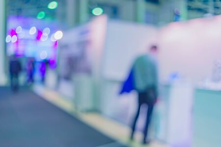 Blurred background the industrial exhibition - wonderful bokeh of light sources.の写真素材