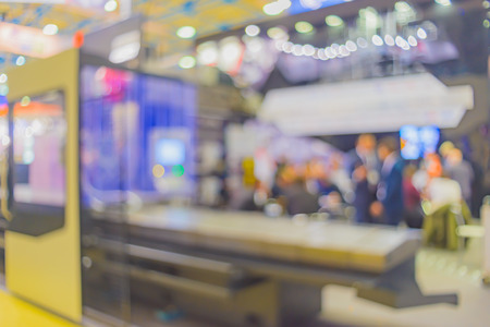 Blurred background- abstract bokeh of light sources. Industrial exhibition- equipment, devices and tools for metalworking industry.の写真素材