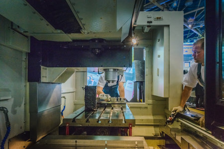 MOSCOW, RUSSIA, Expocentre - MAY 15-19, 2017: 18th international specialized exhibition "Equipment, instruments and tools for Metalworking industry". People conduct business meetings at booths productのeditorial素材