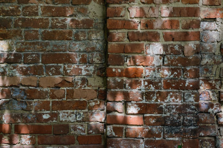 Brick wall  background. Use as design element of residential and office interiors, rough, cracked...