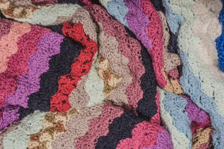 Art cloth. Crumpled texture- multicolor knitted scarf. Beautiful abstract background.
