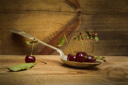 Still life- cherry wooden background- autumn nature. Abstract scene for drawing objectsの写真素材