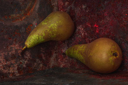Still life pear. Rusty metal background- autumn nature. Abstract scene for drawing objectsの写真素材