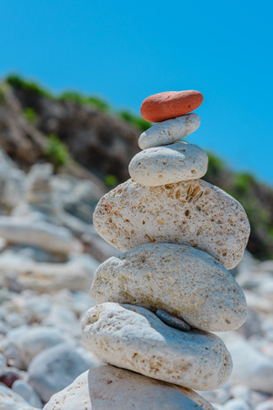 Heap of stones- cobble. Boulders on the beach on background of blue sky- abstract natural landscapeの写真素材