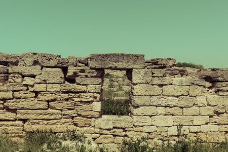 Old ruins of a brick- stone walls of the ancient city. National archaeological park.の写真素材