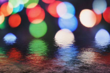 Reflection of the holiday lights- colored circles bokeh. Abstract blurred backgroundの写真素材