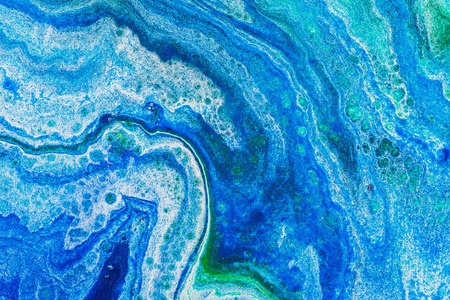 Fluid art. Abstract illustration - stain, splashes, smearing the dye. Liquid acrylic- paint on canvas. Pigment water background.の写真素材