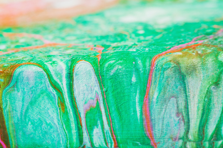 Fluid art. Abstract illustration - stain, splashes, smearing the dye. Liquid acrylic- paint on canvas. Pigment water background.の写真素材