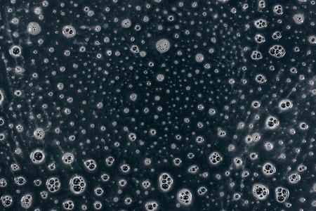 Texture liquid soap- drawing technique. Art fluid paint- cleansing wash. Creating abstract work- combinations of color, contrasts of smooth lines. Bubbles shampooの写真素材