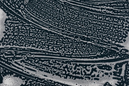 Texture liquid soap- drawing technique. Art fluid paint- cleansing wash. Creating abstract work- combinations of color, contrasts of smooth lines. Bubbles shampooの写真素材