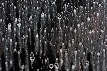 Background wet- raindrop realistic. Water splash shower- bad weather. Window- soap foam. Rainwater- liquid splash abstractの写真素材