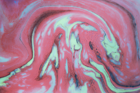 Fluid art- marbled effect. Abstract artwork- stain, splashes, smearing the dye. Liquid acrylic- color blot. Pigment water backgroundの写真素材