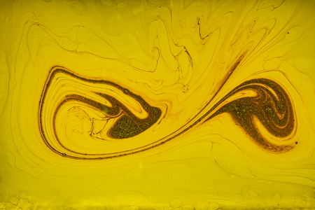 Fluid art- marbled effect. Abstract artwork- stain, splashes, smearing the dye. Liquid acrylic- color blot. Pigment water background- paint mixing.の写真素材