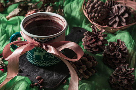 Still life- dark food photo. Coffee mug and sweets on a black background