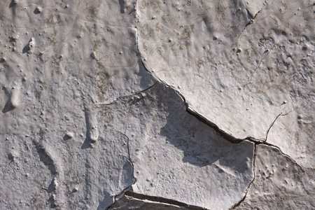 Destroyed plaster on the wall. Numerous cracks, chips and peeling paint. Texture- damaged material