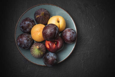 Beautiful fruits and vegetables prepared for food. Kitchen utensils on an abstract backgroundの写真素材