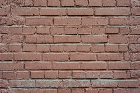 A brick wall is an element of a city building. Architecture- abstract background