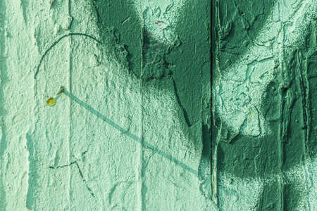 An old wall damaged- city building. Architecture- abstract background. Remnants of paint and plasterの写真素材