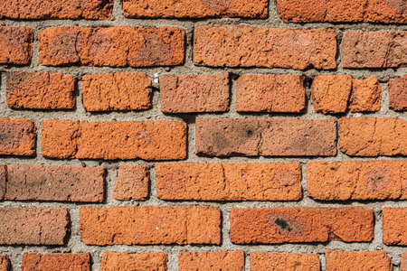 A brick wall is an element of a city building. Architecture- abstract background