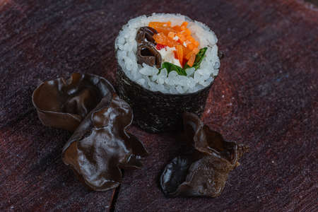 Wood ear mushroom - black fungus. Japanese sushi - fast food. Asian traditional snack. Preparing healthy snackの写真素材