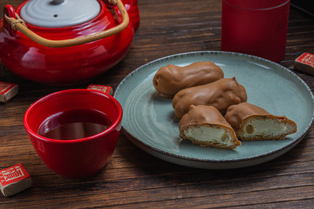 Tea time - ceremony items and sweets. wooden background