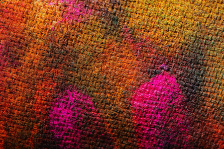 Paint on canvas is a chaotic pattern on fabric. Abstract background - a piece of fabric painted...