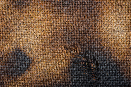 A burnt canvas is a fabric destroyed by fire. broken thread structure