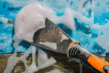 Soap foam on glass - cleaning of contaminated surfaces. clean backgroundの写真素材