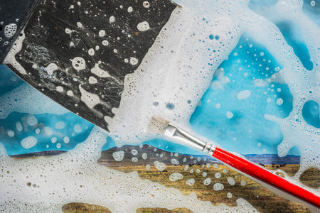 Soap foam on glass - cleaning of contaminated surfaces. clean backgroundの写真素材