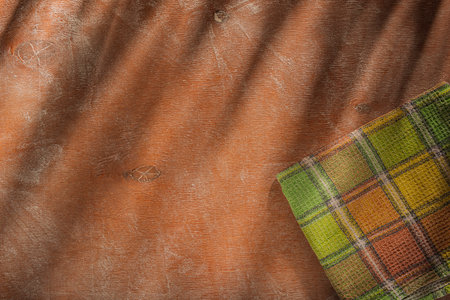 Wooden background with checkered tablecloth. Toned.の写真素材