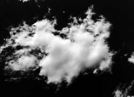 Set of isolated clouds over black background. Design elements. White isolated clouds. Cutout extracted clouds.の写真素材