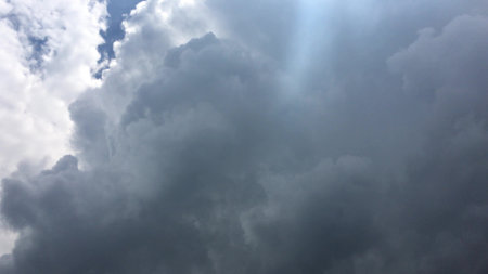 White clouds disappear in the hot sun on blue sky. Motion white clouds blue sky background.