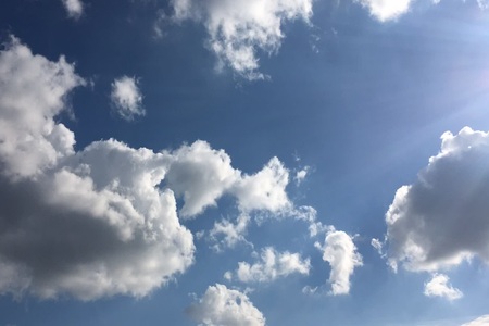 White clouds disappear in the hot sun on blue sky. White Clouds. Blue sky.の写真素材