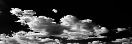 Isolated white clouds on black sky. Set of isolated clouds over black background. Design elements....