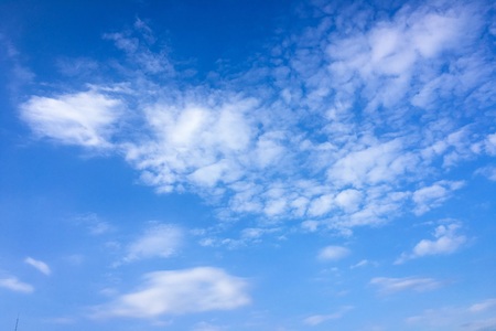Beautiful clouds against a blue sky background. Cloud sky. Blue sky with cloudy weather, nature cloud. White clouds, blue sky and sunの写真素材