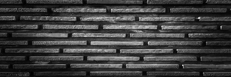 black brick wall, dark background for design. Part of black painted brick wall. Emptyの写真素材