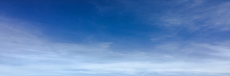 Beautiful clouds against a blue sky background. Cloudscape sky. Blue sky with cloudy weather, nature cloud. White clouds, blue sky and sunの写真素材