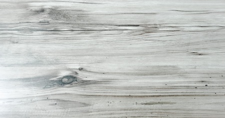 wood background texture, light weathered rustic oak. faded wooden varnished paint showing woodgrain texture. hardwood washed planks background pattern table top view.の写真素材