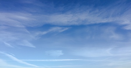 Beautiful clouds against a blue sky background. Cloud sky. Blue sky with cloudy weather, nature cloud. White clouds, blue sky and sun.の写真素材