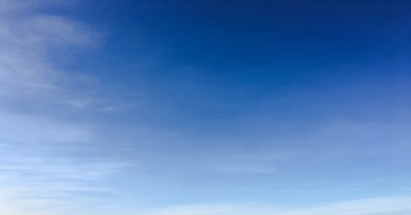 Beauty cloud against a blue sky background. Clouds sky. Blue sky with cloudy weather, nature cloud. White clouds, blue sky and sunの写真素材